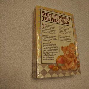 NEW "WHAT TO EXPECT THE FIRST YEAR" PAPERBACK BOOK